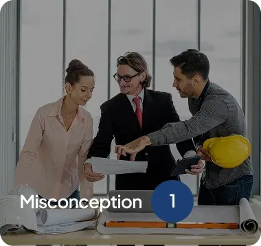 Three architects or engineers reviewing blueprints around a table with a helmet and rolled plans.