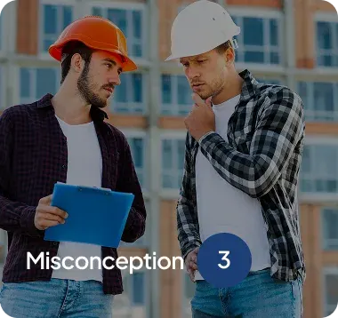 Two construction workers wearing hard hats reviewing a clipboard outside a building under construction.