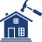 Blue icon of a hammer above a factory building with a prohibition symbol.